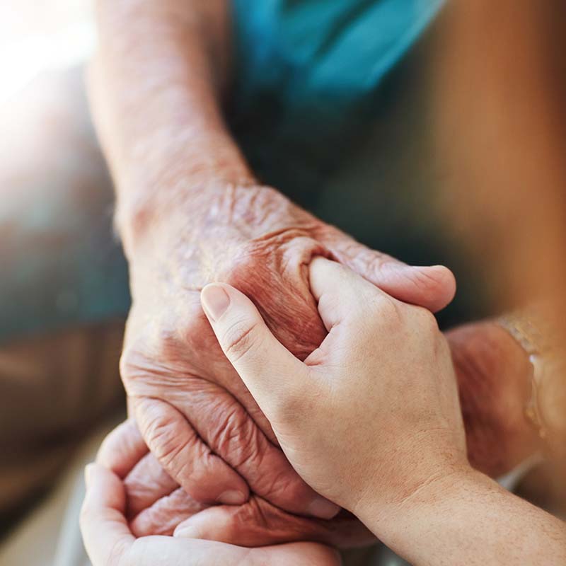 Photo of old and young hands holding